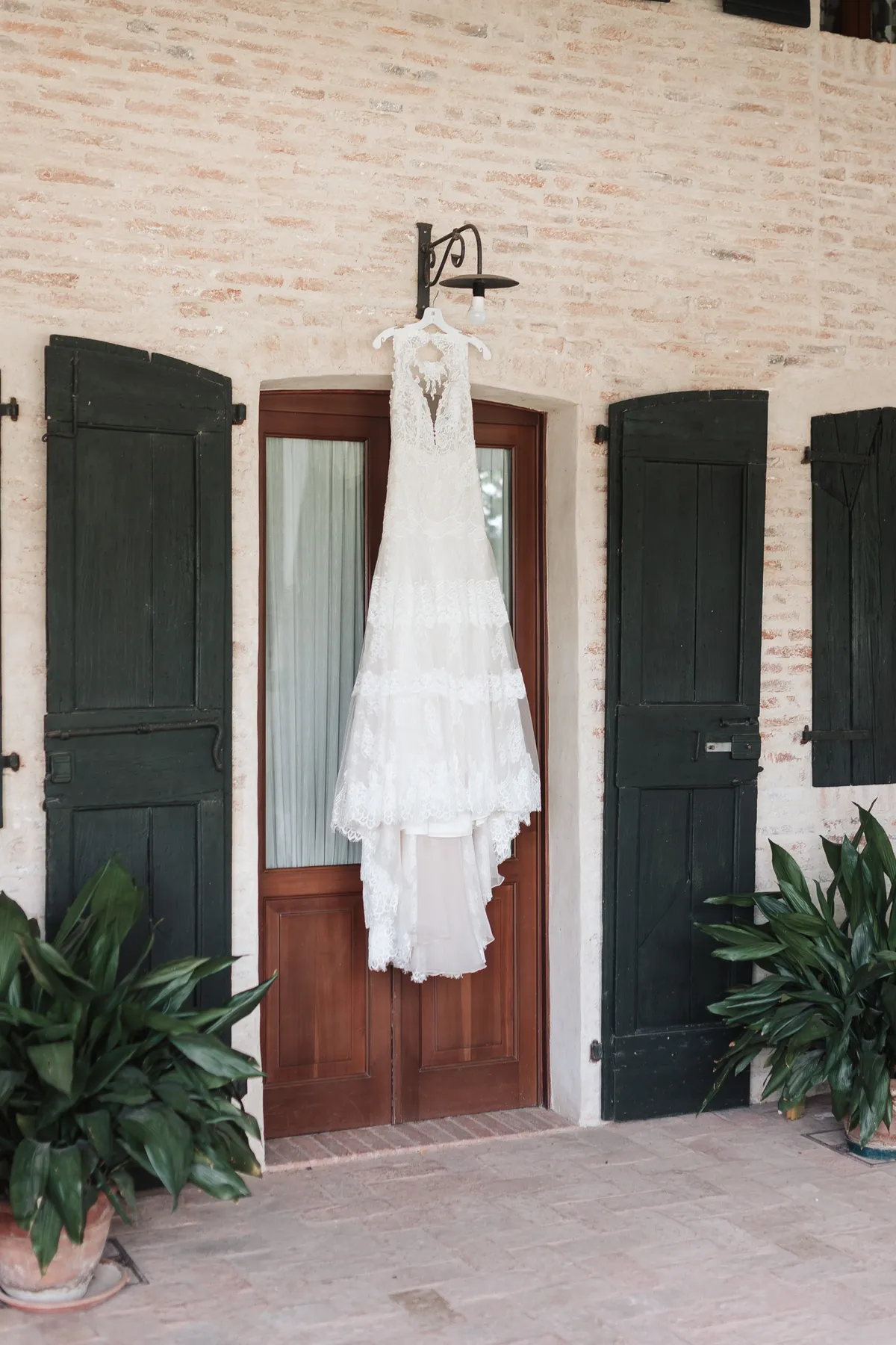 Wedding dress hanging in a Veneto villa on the wedding day
